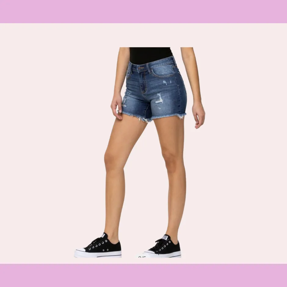 Dark denim cut off shorts with distressed detail and a raw hem